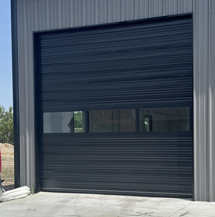 Two commercial rolling overhead doors with chain-operated hardware